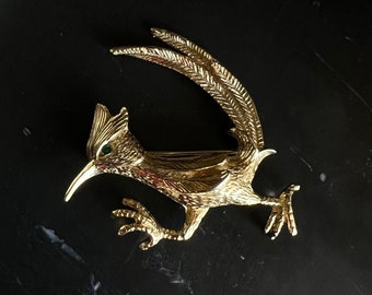 Vintage gold tone green rhinestone Castlecliff roadrunner brooch pin