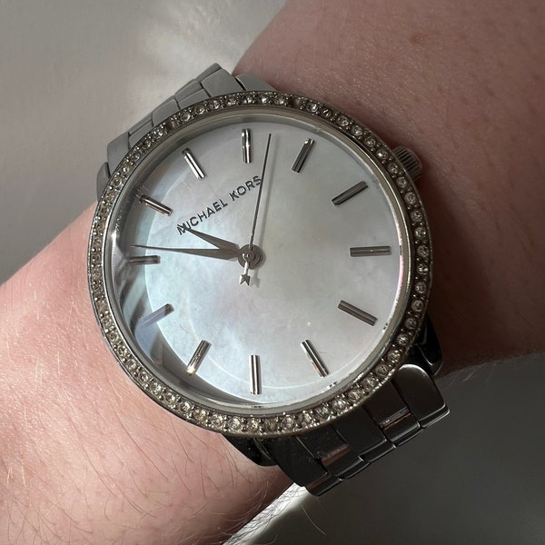 Mother of Pearl, crystal, and silver tone Michael Kors vintage white wrist watch