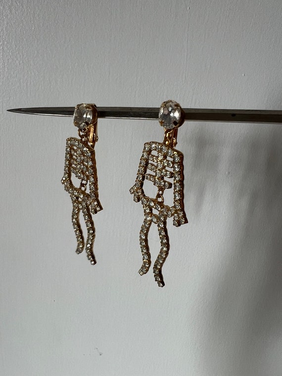 Articulated skeleton drop earrings, gold metal an… - image 2