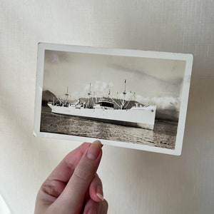 Antique black and white picture postcard with a ship from the 1910s