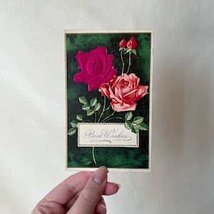 Antique metallic colorful and embossed rose postcard from 1919, with a message and signature