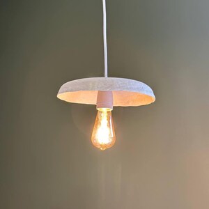 Industrial gold paper mache light for loft interiors