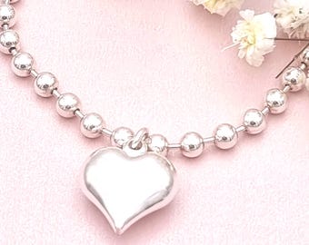 Sterling silver heart charm bracelet.