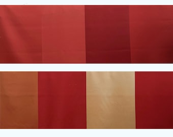 May include: Two rows of fabric swatches showcasing a range of red and tan hues. The top row features four rectangular sections of varying shades of red. The bottom row displays a similar pattern, with sections of tan and red.