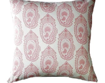 May include: A white pillow with a pink paisley pattern. The pillow is made of a soft, comfortable fabric and has a subtle sheen.