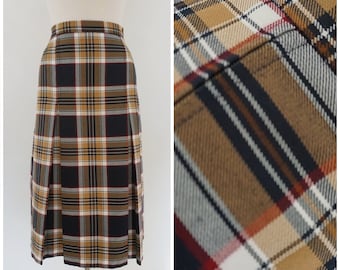 May include: A brown, black, white, and red plaid skirt with pleats. The skirt is knee-length and has a straight silhouette.
