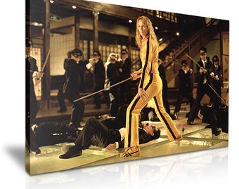 May include: A woman in a yellow and black jumpsuit stands in a room with a sword in her hand. She is surrounded by men in black suits who are lying on the floor. The room is decorated with Japanese-style architecture.