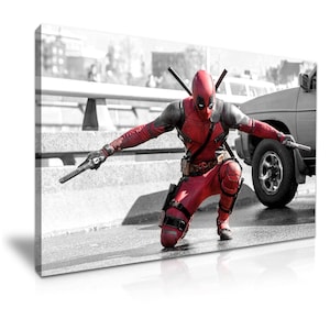 May include: A red and black superhero figure in a kneeling pose, holding two swords. The figure is in a black and white setting with a blurred background.