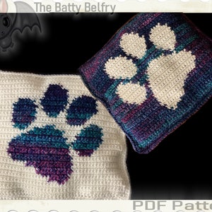 May include: Two crocheted pillow covers with a paw print design. The paw print on the left is a multi-colored design on a white background. The paw print on the right is white on a multi-colored background. The text "The Batty Belfry" and "PDF Pattern" are visible in the image.
