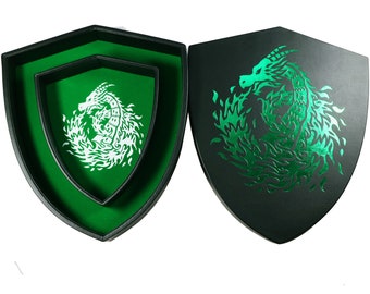 May include: A green felt dice tray shaped like a shield with a green dragon design on the outside and a white dragon design on the inside.