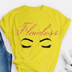 May include: Yellow t-shirt with the word "Flawless" in pink glitter lettering and a pair of closed eyes with eyelashes.