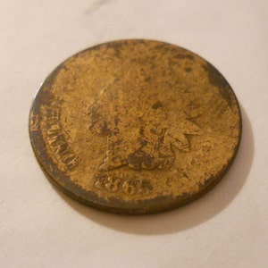 1865 Indian head penny , fair shape, collectible gold or bronze colored 1865 Indian head  penny