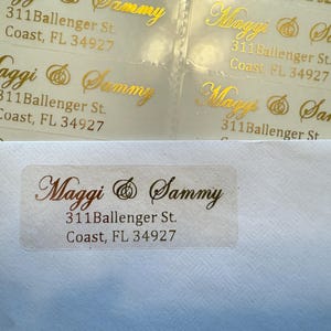 May include: Gold foil return address labels with the names "Maggi & Sammy" and the address "311 Ballenger St. Coast, FL 34927".