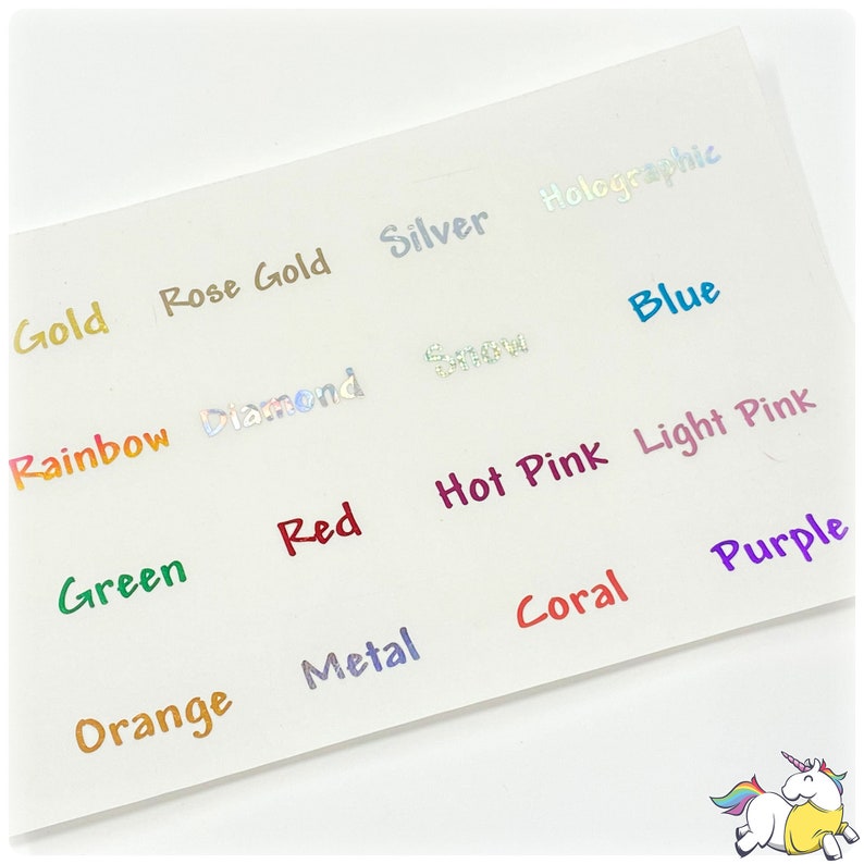 May include: A white surface with various color names written in different colors. The colors include gold, rose gold, silver, holographic, rainbow, diamond, blue, green, red, hot pink, light pink, orange, metal, coral, and purple.