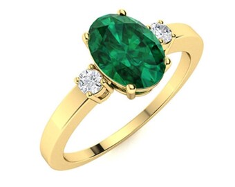 May include: A gold ring with an oval-shaped emerald gemstone and two smaller round diamonds on the band.