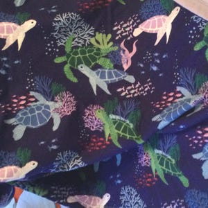 Turtle Love - turtles gliding in their natural habitat.  Super soft and fun.  Colors are blues and purples.  Different backing options.