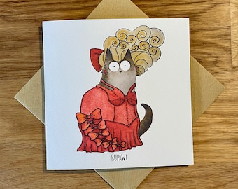 May include: A greeting card featuring a cartoon cat wearing a red dress with bows and a blonde wig. The text "RUPAWL" is printed below the cat.