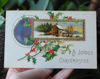 1910's A Joyous Christmastide Post Card - A House In Snow - Holly - Embossed Holiday Postcard - Printed In Germany - Antique - Early 1900's