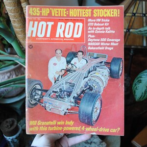 May include: A vintage Hot Rod magazine cover featuring a red, white, and blue race car with the text "435-HP VETTE: HOTTEST STOCKER!" and "Will Granatelli win Indy with this turbine-powered, 4-wheel-drive car?"