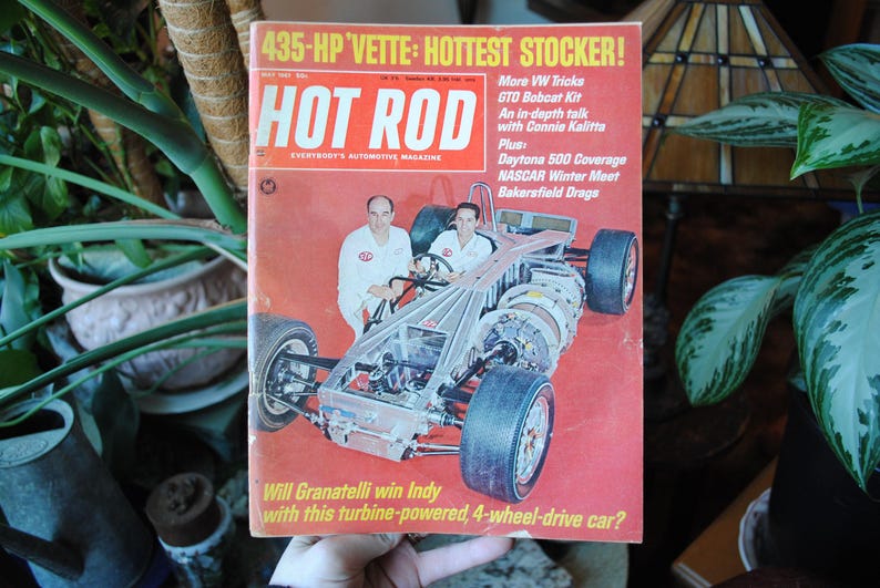 May include: A vintage Hot Rod magazine cover featuring a red, white, and blue race car with the text "435-HP VETTE: HOTTEST STOCKER!" and "Will Granatelli win Indy with this turbine-powered, 4-wheel-drive car?"