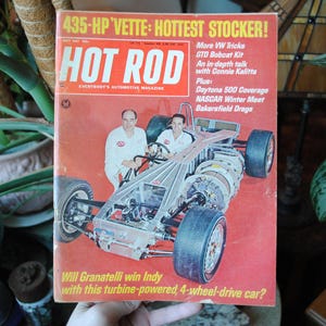 May include: A vintage Hot Rod magazine cover featuring a red and white race car with a turbine engine. The cover text reads "435-HP Vette: Hottest Stocker!" and "Will Granatelli win Indy with this turbine-powered, 4-wheel-drive car?"