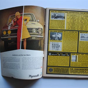 May include: A vintage magazine ad for Plymouth cars featuring a woman in a red and yellow dress standing next to a red and white Plymouth car. The ad text reads "Goldilocks and the two Bears". The magazine also features an ad for Ed Iskenderian Racing Cams.