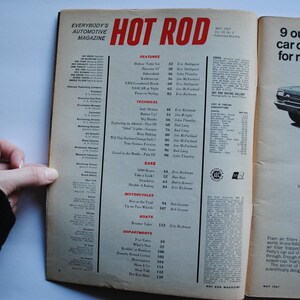May include: A vintage magazine cover for Hot Rod magazine, May 1967. The cover features a red and white car with a black stripe. The text on the cover reads "Everybody's Automotive Magazine" and "Hot Rod".
