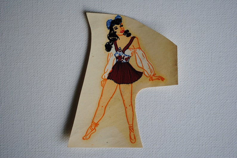 May include: A vintage illustration of a woman wearing a white and red dress with a blue headband. The woman is standing with her legs slightly apart and her arms outstretched. The illustration is on a light brown background.