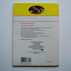 May include: A yellow and white book cover with a picture of a cartoon character. The book is titled "Step right up! Step right up!" and features a list of characters including Pee-wee Herman, Vance, and Om.