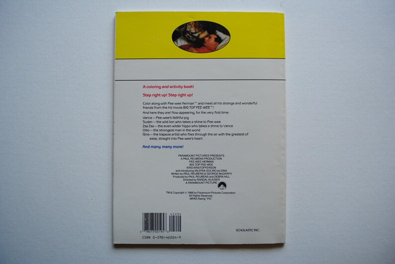 May include: A yellow and white book cover with a picture of a cartoon character. The book is titled "Step right up! Step right up!" and features a list of characters including Pee-wee Herman, Vance, and Om.
