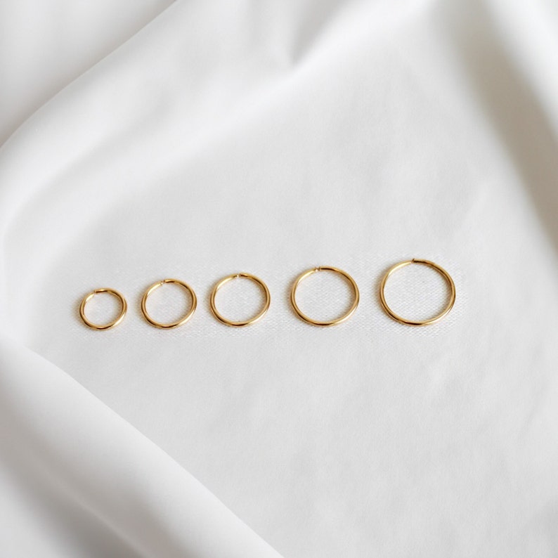 five infinity hoops in 14k gold fill demonstrating various sizes