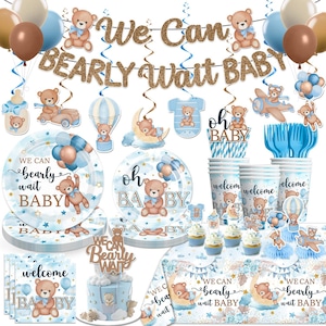 May include: A baby shower party set with a teddy bear theme. Includes plates, cups, napkins, a cake, and decorations with the text "We Can Bearly Wait Baby" and "Oh Baby". The color scheme is blue, brown, and gold.