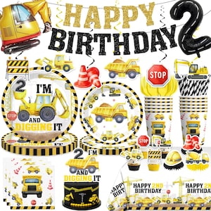 May include: A construction-themed birthday party set with a banner that reads "Happy Birthday". Includes plates, cups, napkins, and a cake with construction vehicle designs. The number "2" is featured prominently.