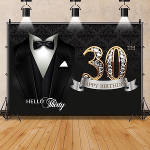 May include: Black and gold 30th birthday party backdrop with a tuxedo and the text "Hello Thirty" and "Happy Birthday".