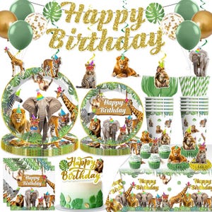 May include: A jungle-themed birthday party set with plates, cups, napkins, and a cake. The set includes animal illustrations, balloons, and a gold glitter "Happy Birthday" banner. The plates and cups feature lions, elephants, and giraffes.