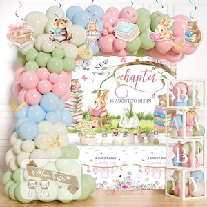 May include: A baby shower decoration set featuring a balloon arch in pastel pink, blue, green, and white, a backdrop with the text A NEW CHAPTER IS ABOUT TO BEGIN, a table cover with floral accents, and four clear boxes displaying the letters B, A, B, Y.