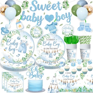 May include: A collection of baby shower decorations in shades of blue and green. The set includes plates, cups, napkins, balloons, and a cake. The text "Sweet baby boy" is displayed prominently. The theme is centered around a baby boy.