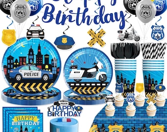 May include: A police-themed birthday party set with balloons, plates, cups, napkins, and a cake. The decorations feature police cars, motorcycles, badges, and the words "Happy Birthday." The color scheme includes blue, black, yellow, and white.