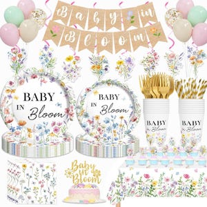 May include: A baby shower party set with floral decorations. Includes plates, cups, napkins, cutlery, a banner that says "Baby in Bloom", balloons, and a cake topper. The set features a floral design with the text "Baby in Bloom".