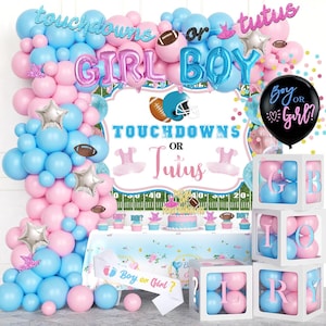 May include: A gender reveal party decoration set with pink and blue balloons, a banner that says "Boy or Girl?", and a cake. The words "Girl" and "Boy" are spelled out in large letters. The theme is "Touchdowns or Tutus".
