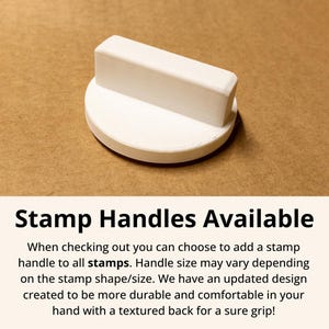 May include: A white stamp handle with a rectangular top and a circular base. The text "Stamp Handles Available" is displayed below the handle, along with additional product information.
