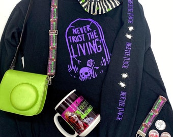 Never trust the living beetlejuice Glow in the Dark long Sleeve Shirt or other items