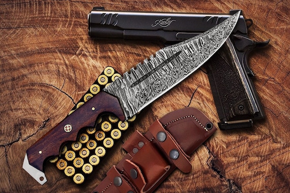 A hand-forged Damascus steel blade with that unmistakable flowing grain — real craft you can see in every ripple of the steel.