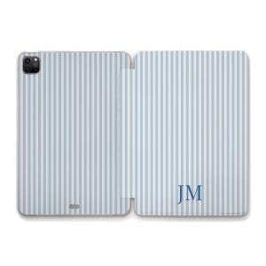 May include: A light blue and white striped tablet case, open to reveal the interior. The case has a vertical stripe pattern. The initials "JM" are displayed in a dark blue font on the right side of the case.