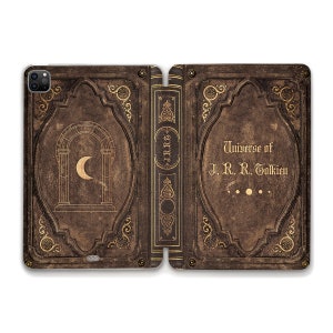 May include: A brown leather-bound book with gold accents and a moon design on the front cover. The spine reads "J.R.R. Tolkien" and the back cover reads "Universe of J.R.R. Tolkien".