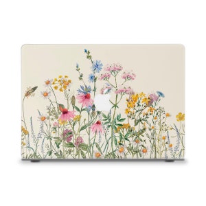 Puede incluir: Una piel para portátil con un diseño de acuarela de un campo de flores silvestres en tonos de rosa, amarillo, azul y verde sobre un fondo crema.