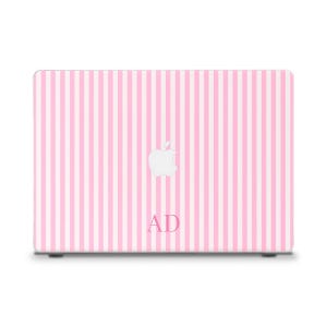 May include: A pink and white striped laptop case with a white Apple logo and the initials "AD" in a light pink font. The case has a vertical stripe pattern.