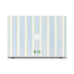May include: A laptop skin featuring a vertical striped pattern in light blue, white, and pale green. The design includes a centered white Apple logo cutout and the green capital letters RM printed near the bottom edge of the rectangular cover.