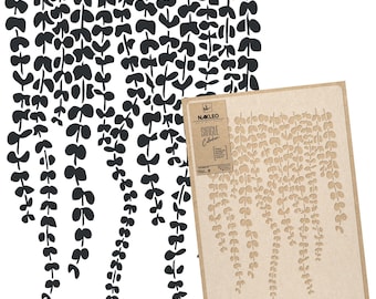 May include: A stencil for creating a wall design featuring a repeating pattern of hanging vines. The stencil is made of brown cardboard and has the text "NAKLEO Single Collection" printed on it.