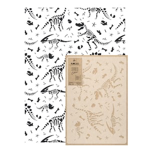 May include: A black and white dinosaur skeleton stencil on a brown background. The stencil is part of a seamless collection by Nakleo.